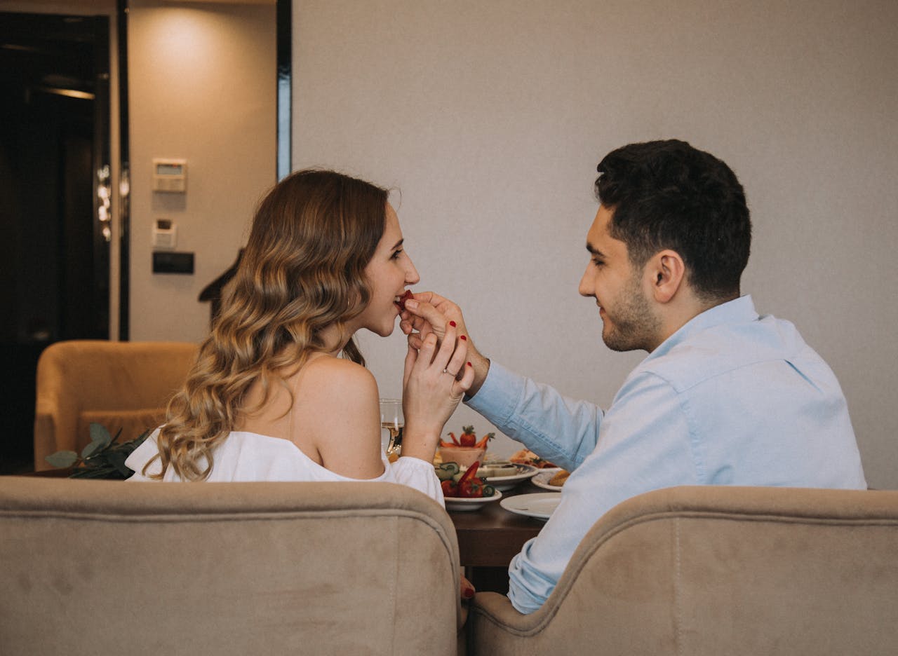 Young couple enjoying a romantic meal together in an indoor setting in Istanbul.